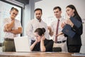 Stressful business young woman with her hands on her head in front of her laptop