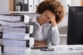 Stressful Businesswoman Sitting In Office