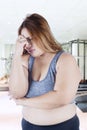 Stressful fat woman in fitness center Royalty Free Stock Photo