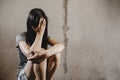 Stressful and hopeless woman sitting on ground Royalty Free Stock Photo