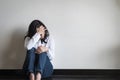 Stressful woman sitting sadly with emotional depression and anxiety on the floor Royalty Free Stock Photo