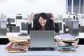 Stressfull businesswoman screaming in office Royalty Free Stock Photo
