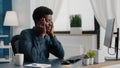 Stressing african american man with big headache pain, suffering from migraine, rubbing his temples Royalty Free Stock Photo