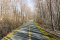 Stretch of Blackstone River Greenway winding through woods on sunny spring morning Royalty Free Stock Photo