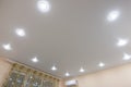Stretch ceiling with built-in fixtures in a large room Royalty Free Stock Photo