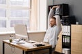 Stretch Exercise At Office Desk. Businessman Royalty Free Stock Photo