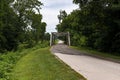 A stretch of the original route 66 wih an old steel bridge in the State of Missouri