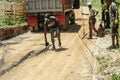 Men Resurfacing A Roadway In Jamaica Friday, July 17, 2020