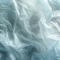 Stretch of a white plastic bag on a smooth blue surface. Disposable material concept Royalty Free Stock Photo