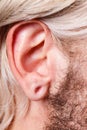 Stretched man ear after tunnel piercing Royalty Free Stock Photo