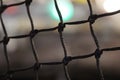 A stretched net at the stadium in close-up with bokeh lights. Royalty Free Stock Photo