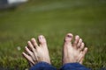 Stretched toes relaxing on Grass Royalty Free Stock Photo