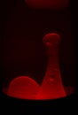 Stretching bubble in a red lava lamp