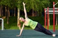 Stretching danser or gymnast woman training in workout sports ground