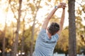 Stretching, fitness and man in park for muscle and body workout, wellness and health in nature with mental health, calm Royalty Free Stock Photo