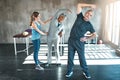 Stretching, physiotherapy and old couple with personal trainer for fitness, wellness and helping. Health, workout and Royalty Free Stock Photo