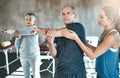 Stretching, physiotherapy and old man with personal trainer for fitness, wellness or rehabilitation. Health, workout or Royalty Free Stock Photo