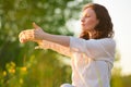 Stretching woman in outdoor exercise smiling happy doing yoga