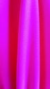 Stretchy fabric in bright pink with a cool tint. Material for tailoring swimwear, sportswear, underwear. On the stretch fabric,