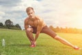 Strething out muscles before exercise Royalty Free Stock Photo