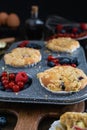 Streusel muffins with blueberry, raspberry and red currant on rustic wooden table Royalty Free Stock Photo