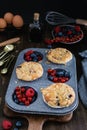 Streusel muffins with blueberry, raspberry and red currant on rustic wooden table Royalty Free Stock Photo