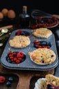 Streusel muffins with blueberry, raspberry and red currant on rustic wooden table Royalty Free Stock Photo