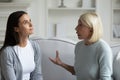 Strict anxious mature mother lecturing annoyed grown daughter Royalty Free Stock Photo