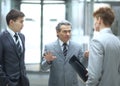 Strict boss talking with an employee.photo on blurred office background