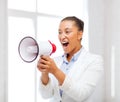 Strict businesswoman shouting in megaphone Royalty Free Stock Photo