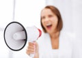 Strict businesswoman shouting in megaphone Royalty Free Stock Photo