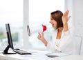 Strict businesswoman shouting in megaphone Royalty Free Stock Photo