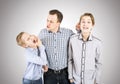Strict father punishes his sons. Royalty Free Stock Photo