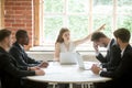 Strict boss telling upset employee to leave room during briefing