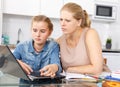 Strict mother checking poorly done home task