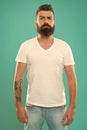 Strict and serious. Beard fashion and barber concept. Man bearded hipster stylish beard turquoise background. Barber