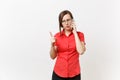 Strict severe serious business teacher woman in red shirt, glasses calls schoolboy parents on mobile phone, summons them