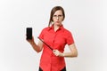 Strict severe serious teacher woman user in red shirt hold mobile smart phone with blank empty screen to copy space Royalty Free Stock Photo