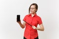 Strict severe serious teacher woman user in red shirt hold mobile smart phone with blank empty screen to copy space Royalty Free Stock Photo