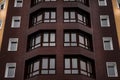 Strict and stylish building facade. Brown orange