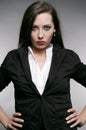 Strict woman in black jacket