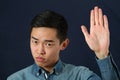 Strict young Asian man giving the stop sign Royalty Free Stock Photo
