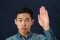 Strict young Asian man giving the stop sign Royalty Free Stock Photo