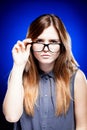 Young woman looking through the nerd glasses