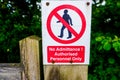 Strictly no admittance to unauthorised persons on wooden gate post Royalty Free Stock Photo