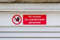 Strictly no unauthorised access sign at construction site security door