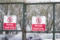 Strictly staff parking only sign on private office car park fence