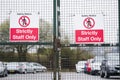 Strictly staff parking only sign on private office car park fence Royalty Free Stock Photo