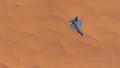 Strike Fighter Jet Aircraft High Altitude Above Sand Dunes Barren Desert