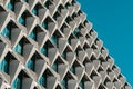 Modern Architectural Facade with Geometric Patterns and Blue Sky Royalty Free Stock Photo